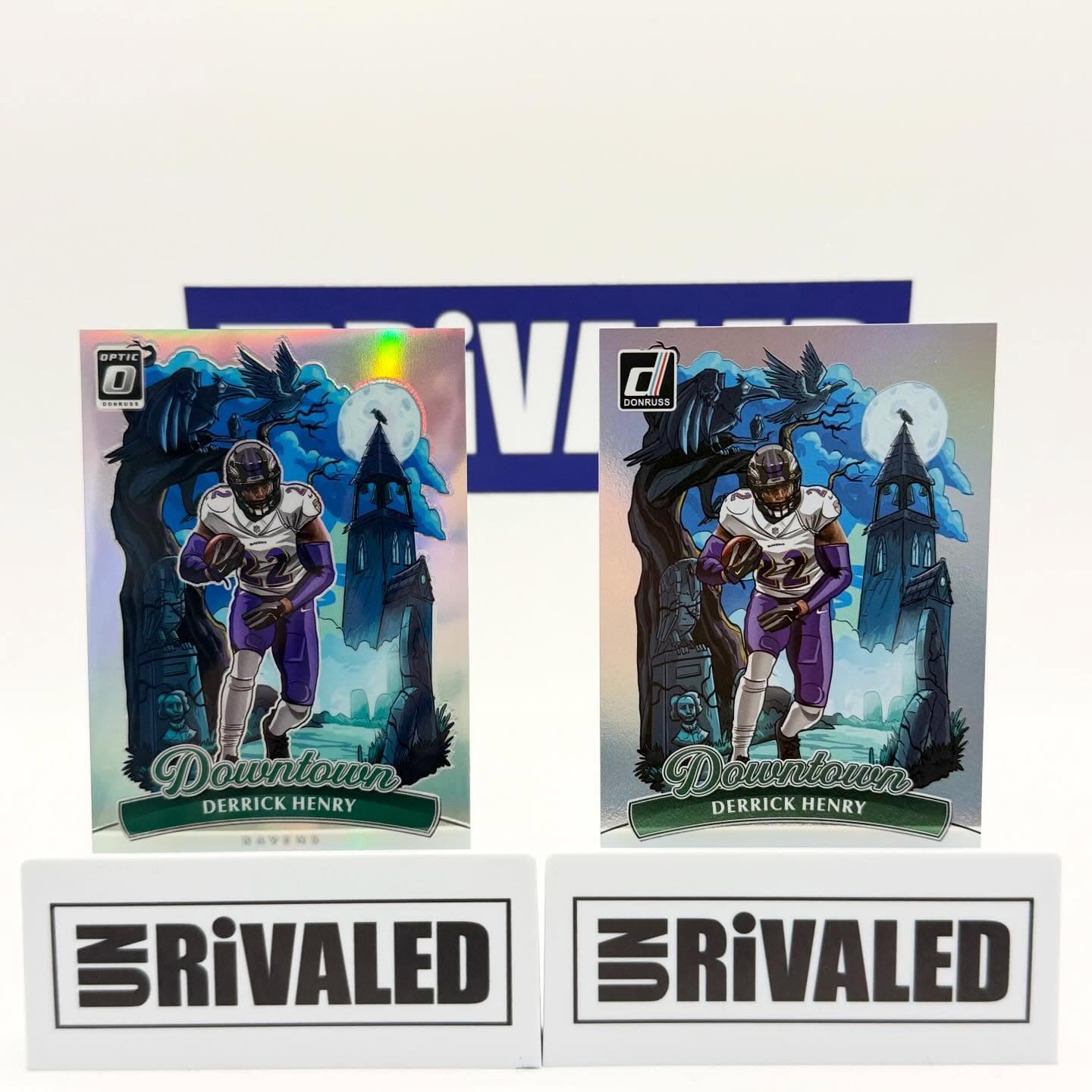 Two Derrick Henry Baltimore Ravens Downtown football cards with a spooky gothic raven theme.